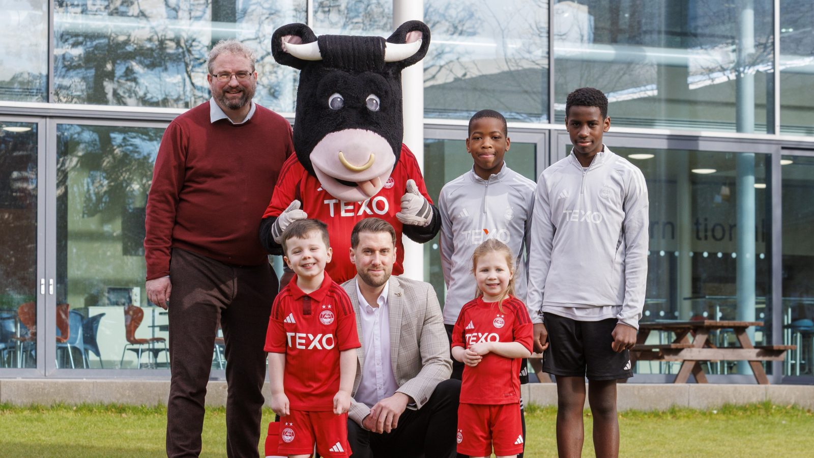 Pictured left to right:  Nick Little (ISA Head of School), Angus the Bull, Daniel Uzowulu, Japheth Imonigie.Front row: Tommy Cheyne, Gary Herbert (AFC Business Development Manager), Alice Veitch