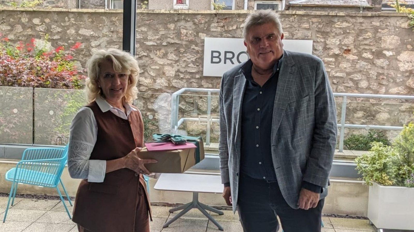 Dr Jeanette Forbes, OBE, the new chair of Aberdeen Inspired, presenting outgoing chairman Allan Henderson, with a special gift of engraved glasses to mark his 13 years with the Business Improvement District. Image - Aberdeen Inspired