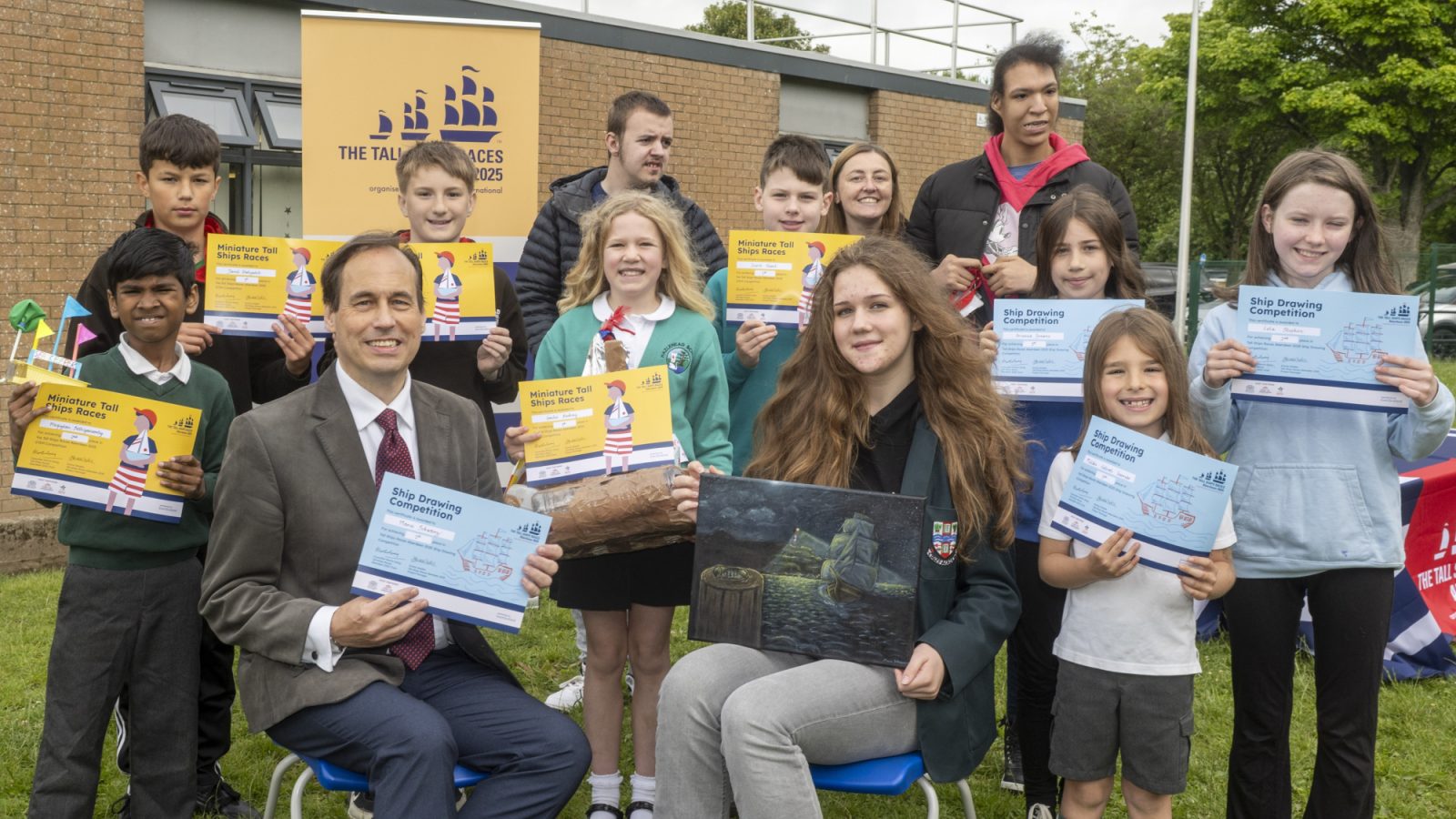 Councillor Martin Greig with the competition winners