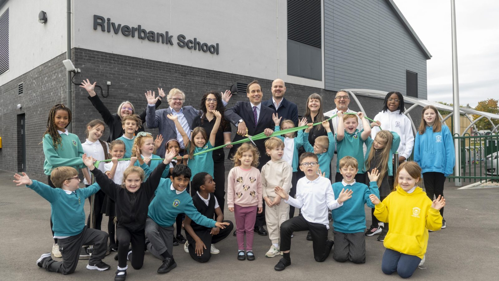 Councillors Martin Greig and Jessica Mennie (centre) with fellow elected members, staff and pupils of the new Riverbank School at the official opening