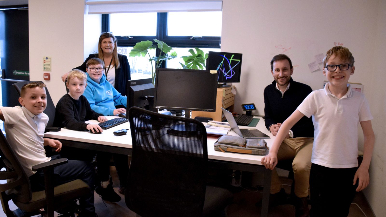 Angie Johnston, ALC Aberdeen’s charity manager and Ian Johnston, senior operations manager, Apache, along with some of the youngsters from ALC Aberdeen.