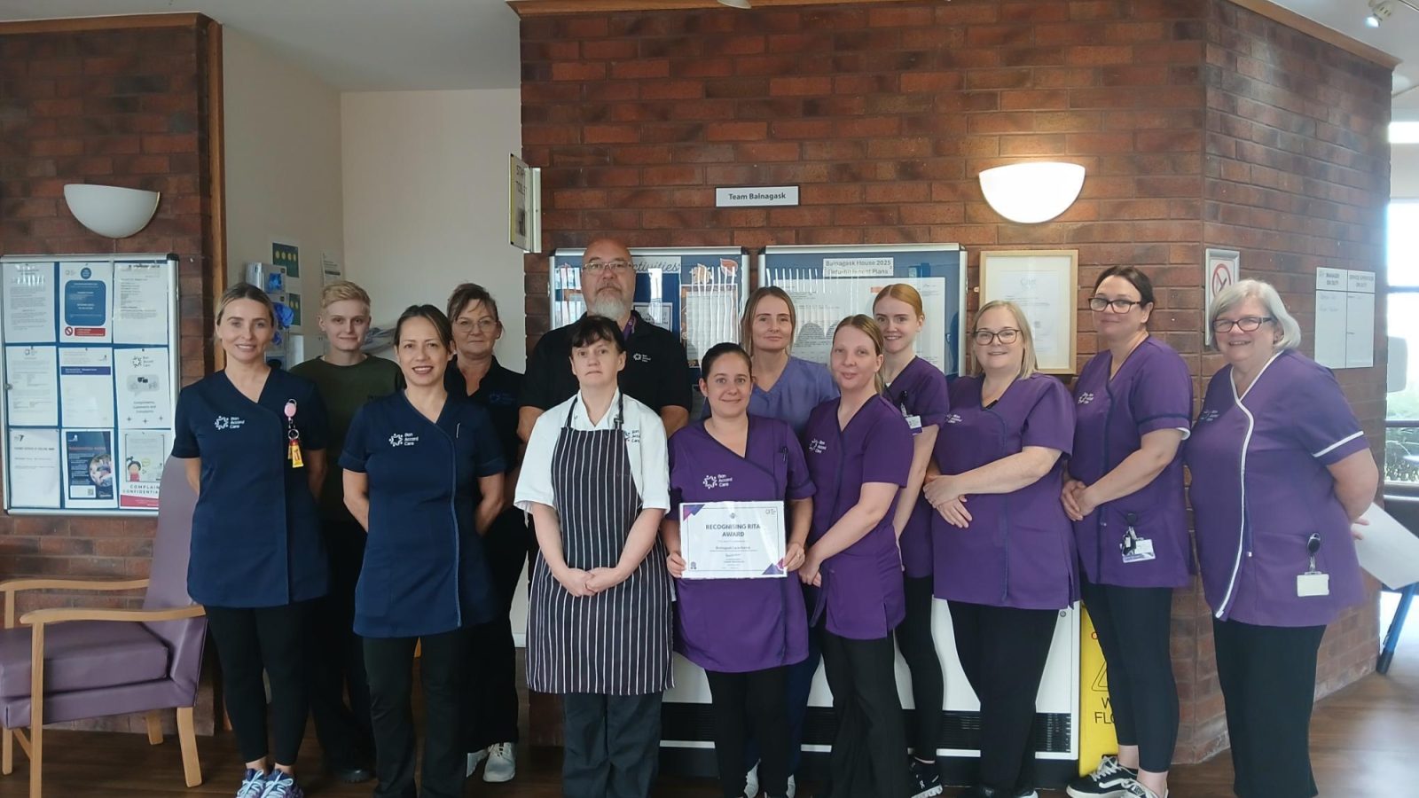 The Balnagask Care Home Team receiving their team Recognising RITA Award