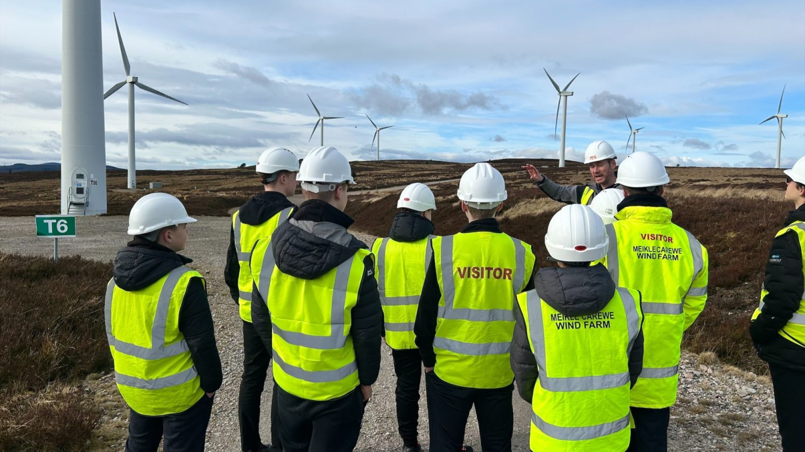 Students from Bucksburn Academy learning about turbine maintenance at the TRIG-owned Meikle Carewe Wind Farm.