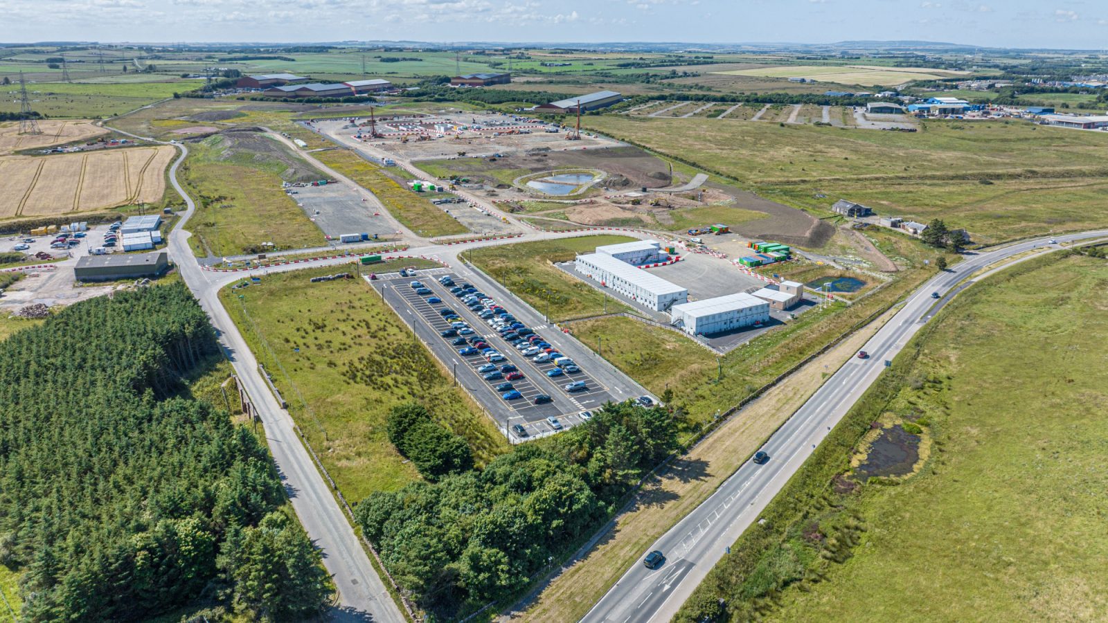 Aerial image showing progress at the EGL2 site in Peterhead and featuring work ongoing at the completed converter station platform to the rear.
