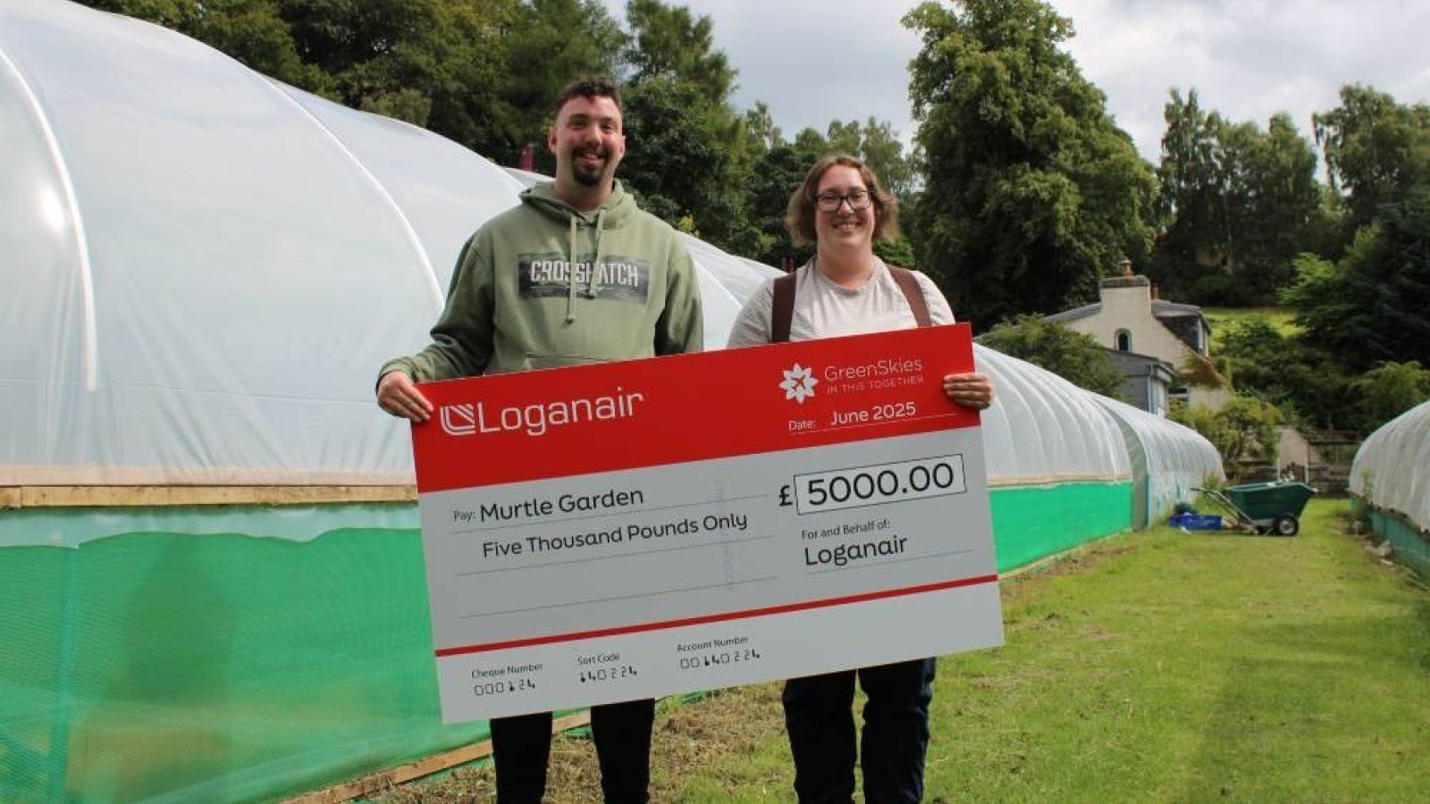 Jon, one of Murtle Garden's young people, with Katherine, garden workshop leader.