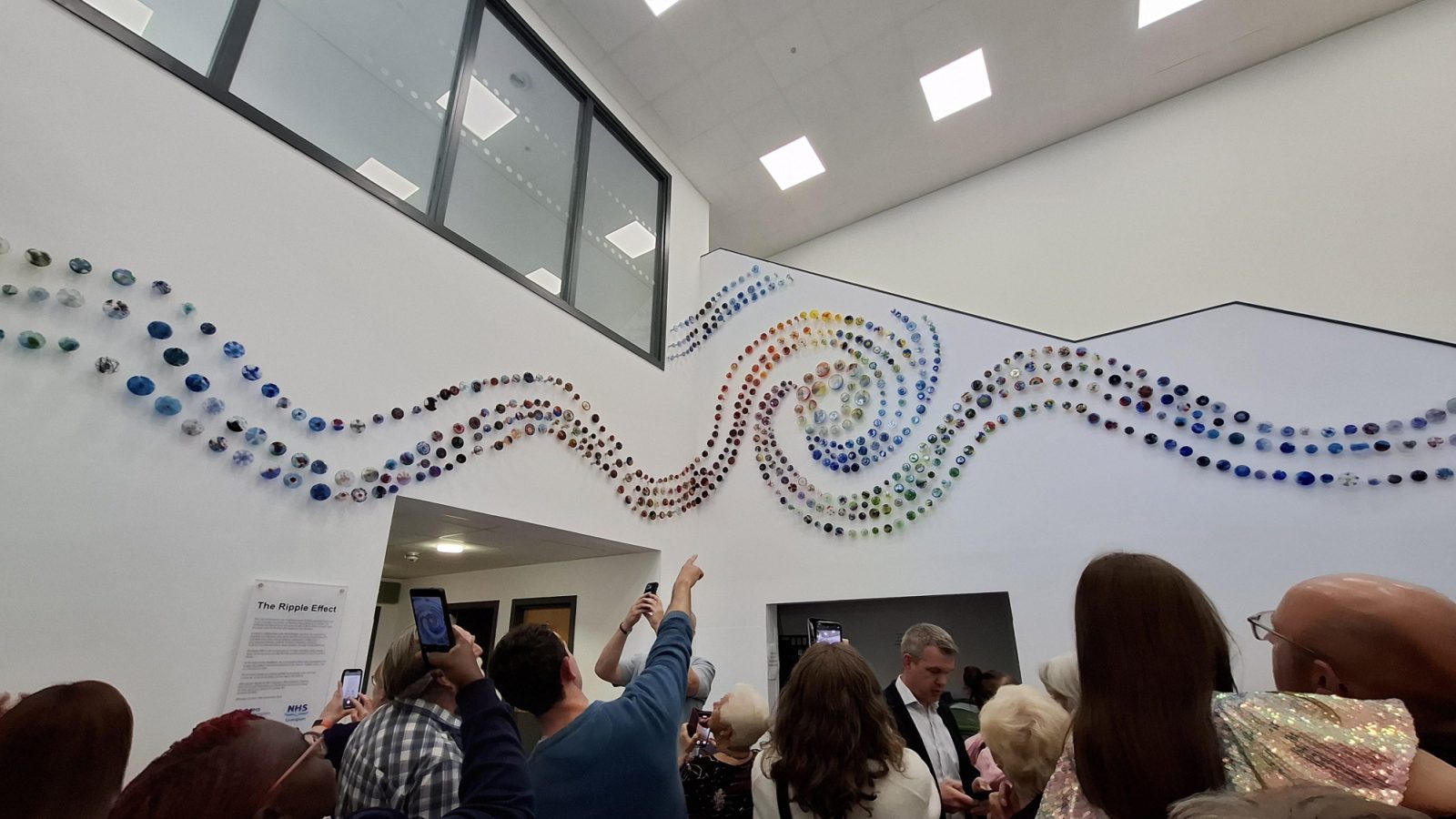 Donor families who contributed to the artwork view it following the unveiling