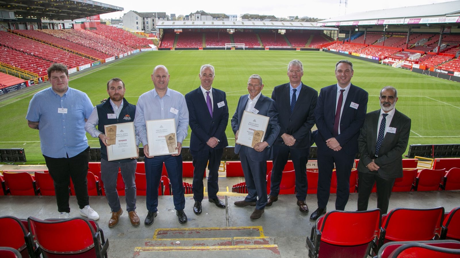 The award winners celebrating their success with senior representatives from Port of Aberdeen.