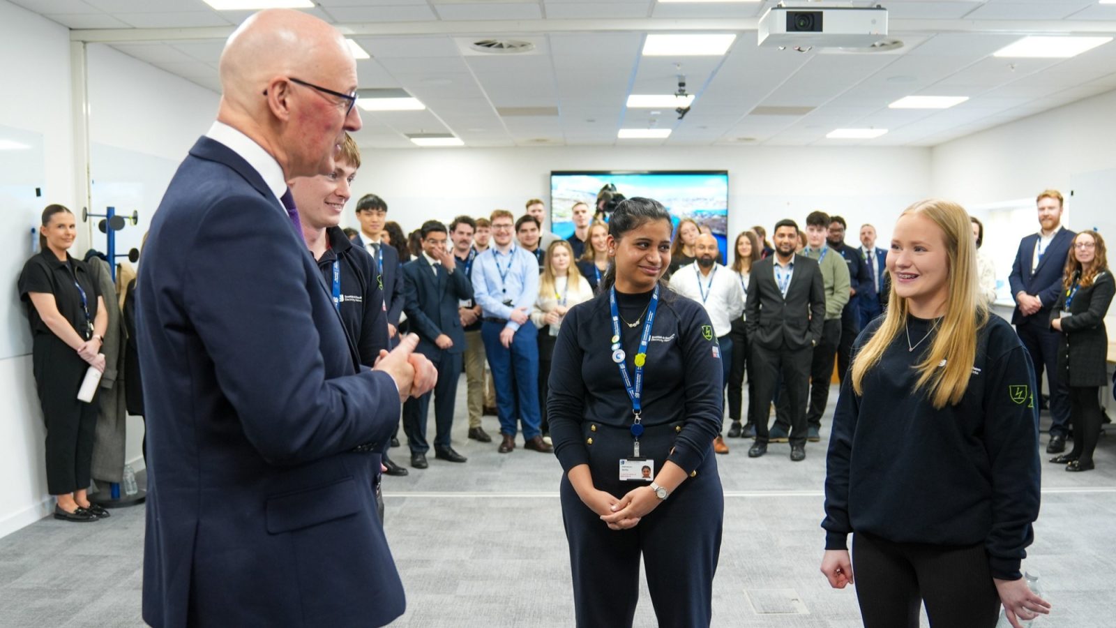 First Minister John Swinney with Graduate Engineer Deepanjali Dayal and Trainee Engineer Isla Mackay