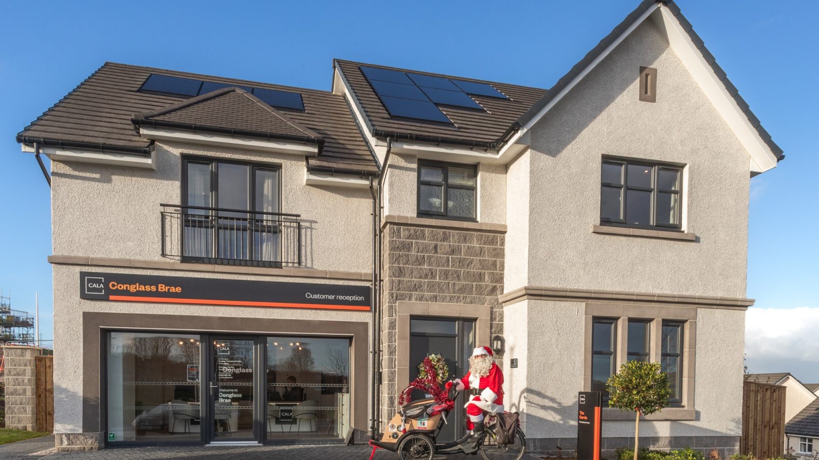Santa Claus in front of Cala’s new Garvie showhome at its Conglass Brae development in Inverurie.
