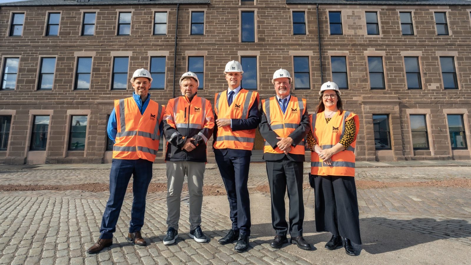 (L-R): Dundee and Angus College Principal Simon Hewitt, CEO of Montrose Port Tom Hutchison, Stephen Flynn MSP, Angus Council Leader George Meechan and Dawn Black MSP for Angus North and Mearns in front of Customs House where the Skills Academy will be based.
