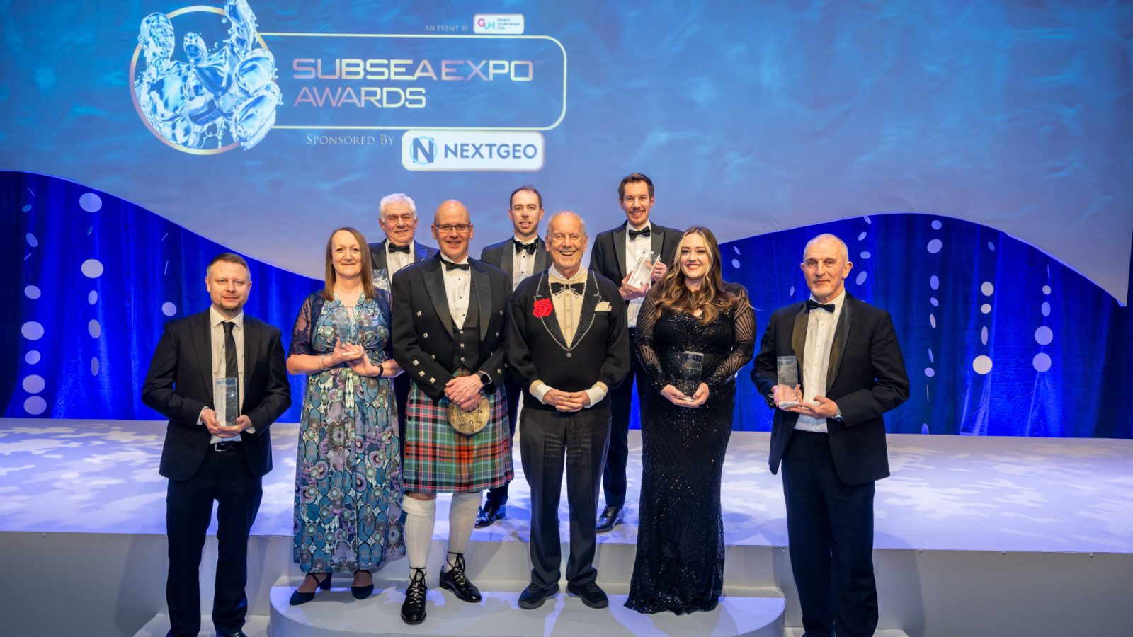 Some of the winners of the 2025 Subsea Expo Awards pictured with Global Underwater Hub chief executive Neil Gordon (in kilt) and Gyles Brandreth