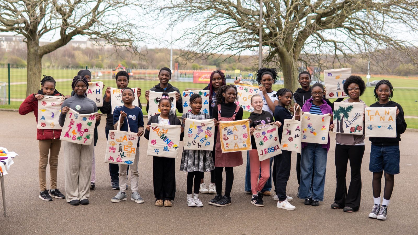 Participants proudly showcase tote bags designed and created during Touch of Love Outreach’s free 2026 Holiday Club in Aberdeen.