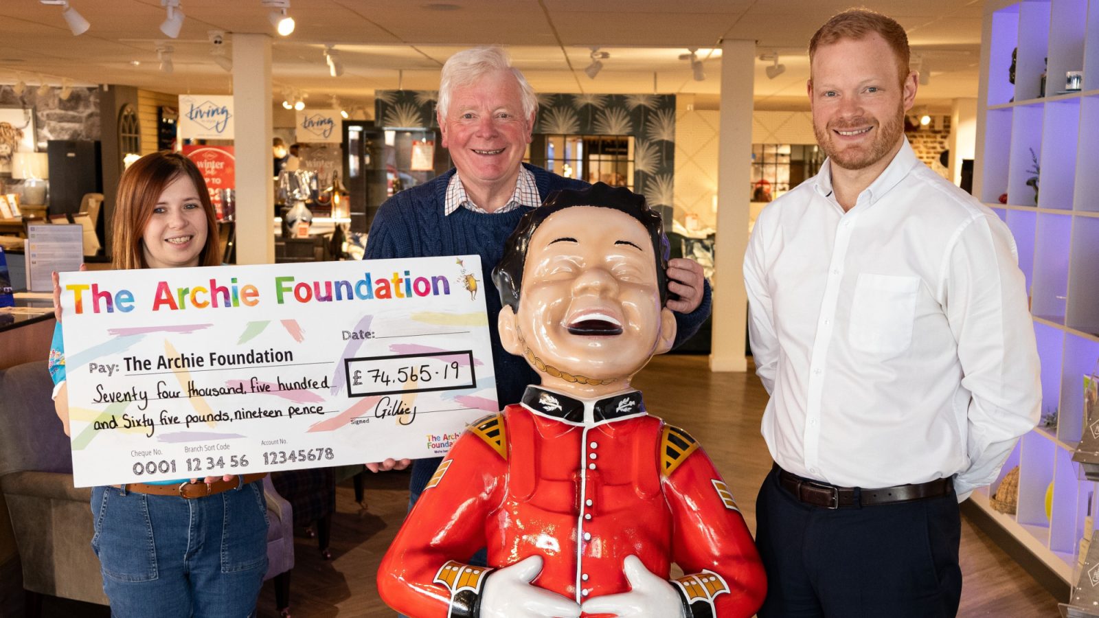 From left, pictured at the Broughty Ferry store are Jamie-Leigh Cook from The Archie Foundation, with Ian Philp and Ewan Philp from Gillies.