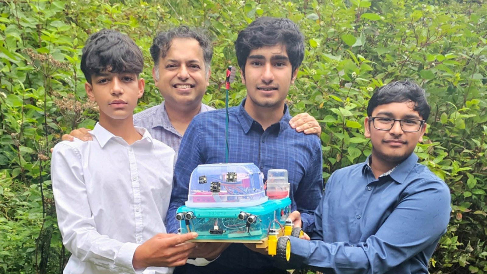 (L to R) Anjishnu Bhaduri, Aranya Bhaduri, Adwait Sharma and Jayawant Sivarajan with the prototype of ThistleDroid