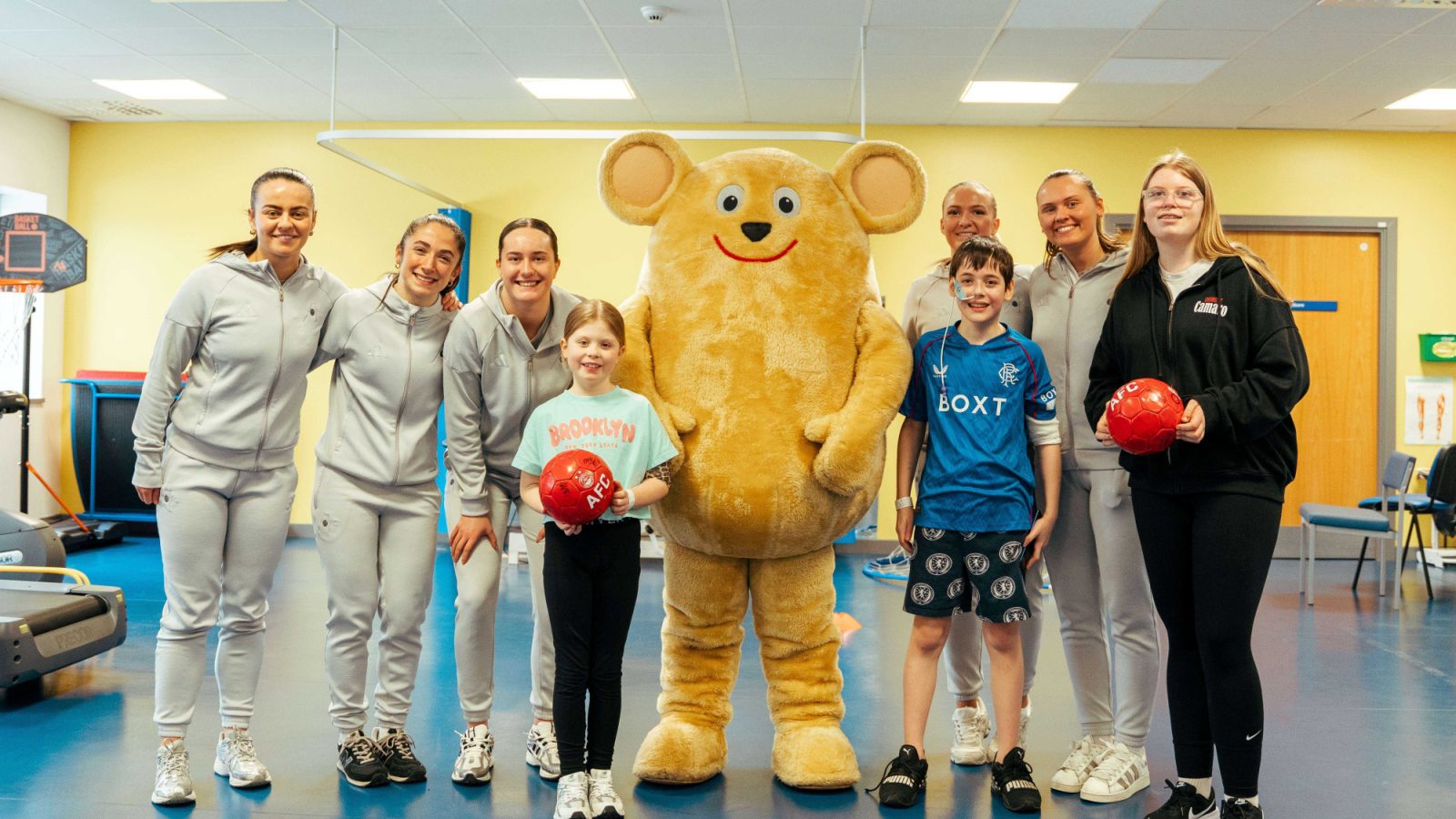 Dons women’s team score smiles with visit to children’s hospital